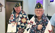 Denny Johnson (left) and Kenny Bassett (right) with their Quilts of Valor.