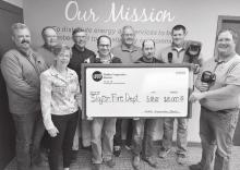 NCE’s Board of Directors presented a $10,000 check to Chris LeTendre and Terry Giesen, volunteers from the Slayton Fire Department.