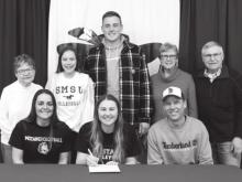 Emily Rohrer with family members signed her letter of intent to play volleyball at Southwest State in Marshall.