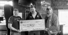 Slayton American Legion Post 64 Commander Brad Pagel accepting $1000 donation from Buffalo Ridge Leathernecks Detachment 1463 Worthington MN toward the Vietnam Wall and Cost of Freedom displays coming to Slayton during the Murray County Fair Aug 15-20 2023. Left to right Vance Johanning, Brad Pagel, Gary Stewart