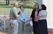 Slayton Mayor Miron Carney visits with US Senator Amy Klobuchar and Wonder World Board’s Ashley Haken and Kyla Buldhaupt.