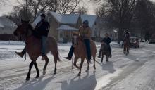 Riders travel through Slayton during the 2024 event.