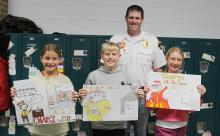 Slayton Fire Chief Chris LeTendre was on hand Tuesday to recognize the winners of the 5th grade Fire Safety Poster Contest. • 1st Place - Reese Johnson • 2nd Place - Merryck Bonnstetter • Third Place - Piper Harmsen Congratulations!