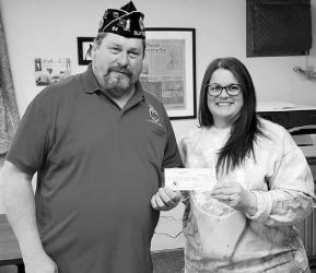 Slayton American Legion Post 64 Commander Brad Pagel accepting $500 donation from Katie Beers with the Wheel-Herald. These funds go toward the Vietnam Wall and Cost of Freedom displays coming to Slayton during the Murray County Fair Aug 15-20 2023