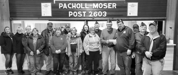 Slayton American Legion Post 64 Commander Brad Pagel accepting $1500 donation from Wilmont VFW Pacholl Moser Post 2603 toward the Vietnam Wall and Cost of Freedom displays coming to Slayton during the Murray County Fair Aug 15-20 2023