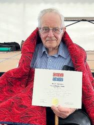 Melvin Johnson with his Quilt of Valor