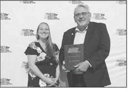 State Sen. Bill Weber (R-Luverne) is presented with the Coalition of Greater Minnesota Cities’ Minnesota Legacy Award.