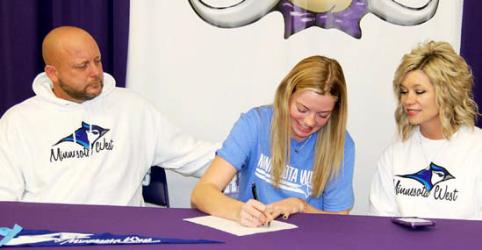 Pictured below with Abby are her family, Dad Darin, Mom Amy, Brother Wyatt, and Minnesota West Assistant Volleyball Coach CJ Nelson.