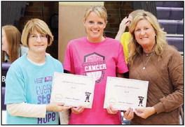 Krista Gillette presented $638 collected from staff jean Fridays.
