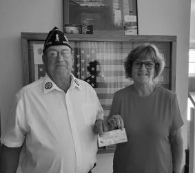 Avoca American Legion Commander Tom Sommers handed over a check to Avoca Mayor Barb Kirchner during the July Avoca City Council meeting. The Avoca Legion sold concessions during the recent Avoca Fun in the Sun event. The proceeds of $780 will go toward the Avoca Veterans Memorial.