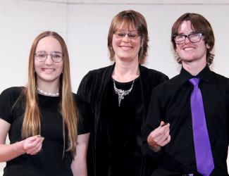 Director Christie Gergen presenting the senior awards to Megan Peterson and Wyatt Biren.