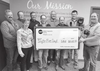 NCE’s Board of Directors presented a $10,000 check to Chris LeTendre and Terry Giesen, volunteers from the Slayton Fire Department.