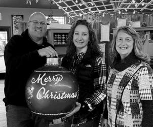 Business Holiday Decorating: VIP Floral and Garden Center was chosen as this year’s business holiday decorating winner. Shown is Stan Van Iperen and Genell Schettler accepting the trophy along with Chamber President, Sheila Crowley.