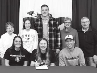 Emily Rohrer with family members signed her letter of intent to play volleyball at Southwest State in Marshall.