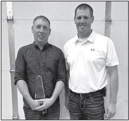 Retired Member of 21 years Dustin Carlson, pictured with Fire Chief Chris LeTendre.