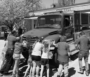 The Fulda Fire Department had some help during a recent Push In Ceremony for their new 805 Tanker, a 2,000 gallon truck with a turret on the front that will allow for fire fighting from inside the cab of the truck.