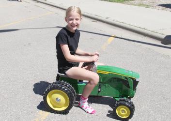 Winner of the John Deere Tractor donated by Kibble Equipment in Tyler, MN was Bristol Tutt.