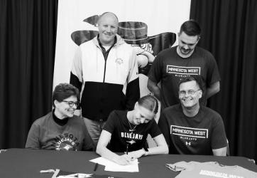 Pictured above with Kate are her family, Mom Stacy, Dad Mark and Brother Noah along with Minnesota West Assistant Volleyball Coach CJ Nelson.