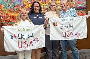 Clarisse Vigouroux of France and Estelle Steiner of Belgium with host parents Shannon and Tim Rhodes.
