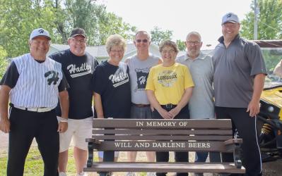 The Hadley Buttermakers Baseball Team recently dedicated a bench in honor of longtime fans, Will and Darlene Beers. Pictured here with Myron Bennett and Rick Like, are family members Denny Beers, Julie Beers, Karen Beers, Randy Beers, and Ryan Beers.