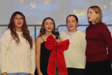 The sixth grade girls ensemble is pictured above as they perform “Peaceful Night”.