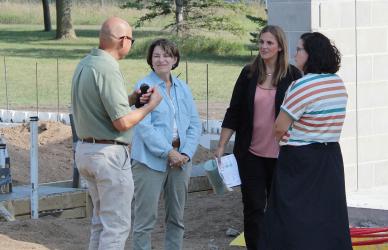 Slayton Mayor Miron Carney visits with US Senator Amy Klobuchar and Wonder World Board’s Ashley Haken and Kyla Buldhaupt.