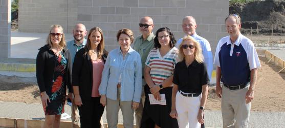 SRDC Robin Weis, Slayton City Administrator Josh Malchow, Wonder World Board member Ashley Haken, US Senator Amy Klobuchar, Slayton Mayor Miron Carney, Wonder World Board President Kyla Buldhaupt, SRDC Jason Walker, Murray County Commissioners Jackie Meier and Mark Carlson.
