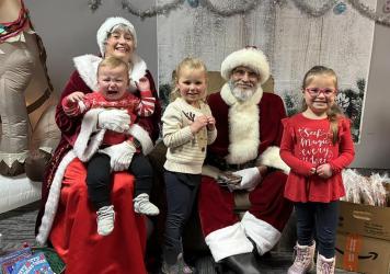 Santa and Mrs. Claus were at Antonio’s in Fulda on Saturday prior to the Parade of Lights parade. They visited with area children who were happy to tell Santa and Mrs. Claus what their Christmas wishes are. Sometimes the youngest of the children were a bit unsure of their visit, but smiled once again when back in their mother’s arms.