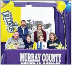 National Signing Day had locals Ashley Overgaauw (blue) and Amanda Overgaauw (white) signing their intent letters to attend Agustana College in Sioux Falls and run on their Cross Country Team this next year. The girls are pictured with their parents Jason and Stacey as well as coaches Dominick Damm and Kristin Nau.