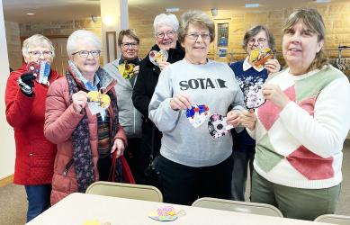 The program for the meeting was to pick up a handmade heart, and place it in the community somewhere to brighten the day of a stranger. Pictured are Doris Carda, Rita Lear, Barb Minnehan, Jan Bryan, Barb Neilson, Jill McCord and Deanna Konkol.