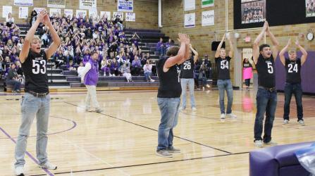 MCC Varsity Football team members cheering at the Friday afternoon Pepfest.