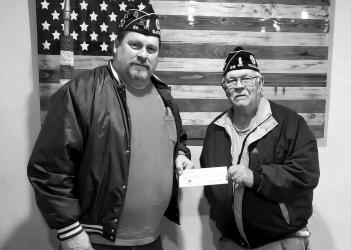 Pictured Left: Slayton American Legion Post 64 Commander Brad Pagel accepting $2000 donation from Fulda American Legion Post 318 Commander Steve Magnus towards the Vietnam Wall and Cost of Freedom Displays coming to Slayton during the Murray County Fair Aug 15-20 2023.