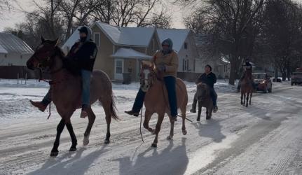 Riders travel through Slayton during the 2024 event.