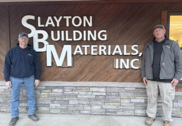 Troy Wehking and Tom Klein celebrate 25 years of ownership at Slayton Building Materials.
