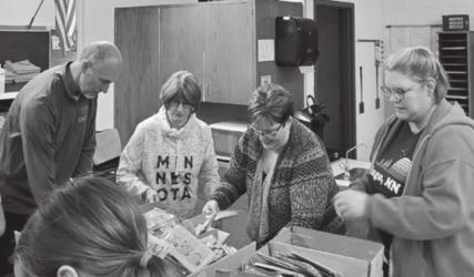 Kiwanis helpers making May baskets.