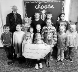 The Sunday school kids at Christ Lutheran Church in Slayton have been busy making stocking stuffers to raise money for the Murray County Christmas Project. They Raised $529.25. Leroy Prahm collected the check from the Sunday school kids.