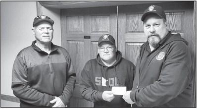 Slayton American Legion Post 64 Commander Brad Pagel accepting $875 donation from Lismore American Legion Post 636 and $875 donation from Lismore SAL Squadron 636 toward the Vietnam Wall and Cost of Freedom displays coming to Slayton during the Murray County Fair Aug 15-20 2023
