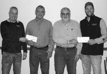 In the photo: Jeff Einck, CEO Manager (left) is shown presenting a retirement equity check to Glen Klingenberg and Josh Bonnstetter, Board Chairman, (right) presents a check to Carl Gengler.