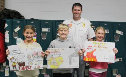 Slayton Fire Chief Chris LeTendre was on hand Tuesday to recognize the winners of the 5th grade Fire Safety Poster Contest. • 1st Place - Reese Johnson • 2nd Place - Merryck Bonnstetter • Third Place - Piper Harmsen Congratulations!