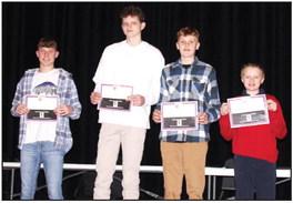 Coach Cariveau challenged students to shoot and report 10,000 shots in the off season. Recognized for this achievement were: Gavin Gillette, Bryce Hoekman, Max Miller and Bobby Keller. Not pictured: Tristan Behrends, Hudson Schryvers.