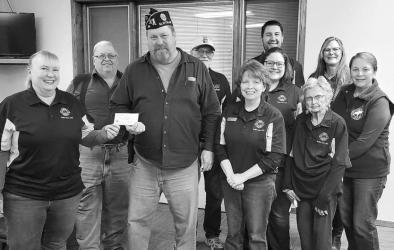 American Legion Commander Brad Pagel accepting $1000 donation from Hadley Lions Club towards the Vietnam Traveling Wall coming to Slayton August 15-20 2023