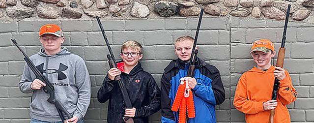 Pheasants Forever of Murray County sponsored a Youth Pheasant Hunt, using the opportunity to teach young sportsmen about hunting and how to clean the game they bagged. Each of the youth shot a bird during the hunt. Above, left to right, Levi Lewis, Brayden Landgren, Tucker Nelson and Jensen Grogan, each holding their new shotgun, courtesy of the Pheasants Forever of Murray County Chapter. Below, Derek Eichner explains dog use and commands to the hunters.
