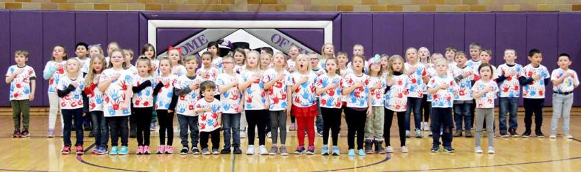 Murray County Central 1st graders sang the National Anthem before the boys’ varsity basketball game on Friday, February 10 to celebrate the 100th day of the school year.